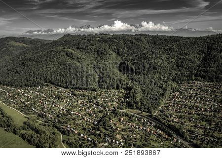 Village And Green Forest. High Tatras Mountains At Background