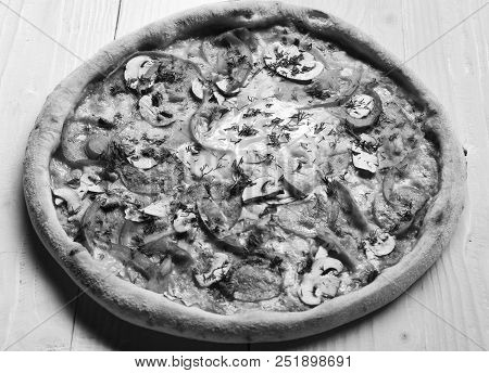 Delivery And Italian Cuisine Concept. Take Away Food With Red Sauce And Crunchy Edges. Spicy Pizza W
