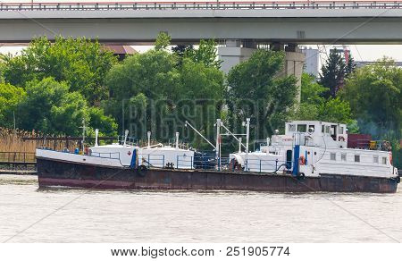 A Small Product Tanker On River. This Will Carry Different Types Of Fuel - Diesel, Kerosene, Petrol 