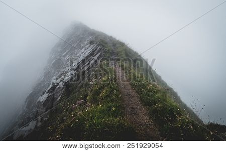 Scary Hiking Path Covered In Fog On The Ridge Of A Mountain In The Swiss Alps, Brienzer Rothorn Swit