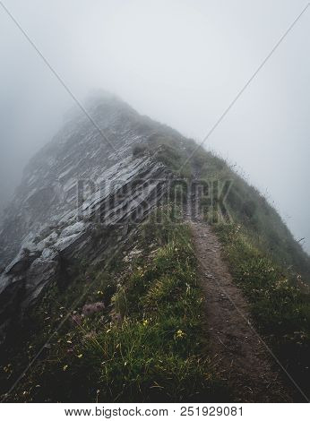 Scary Hiking Path Covered In Fog On The Ridge Of A Mountain In The Swiss Alps, Brienzer Rothorn Swit