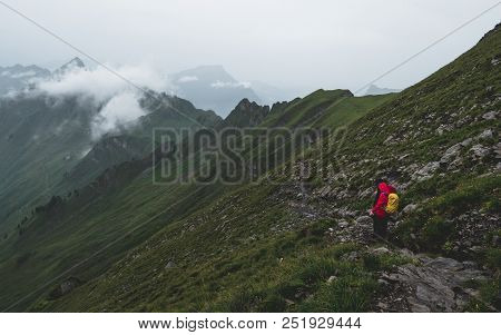Two People Walking Up A Steep Mountain Hiking Path Covered In Fog And Rain, Ridge Walk, Swiss Alps B
