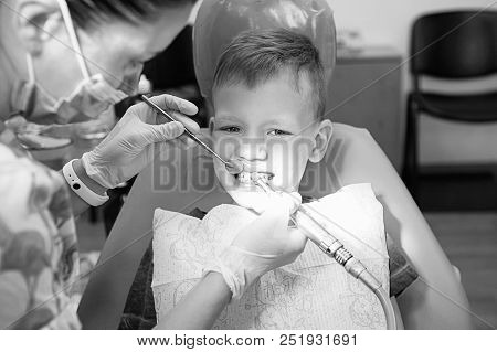 A Little Boy At A Dentist's Reception In A Dental Clinic. Children's Dentistry, Pediatric Dentistry.