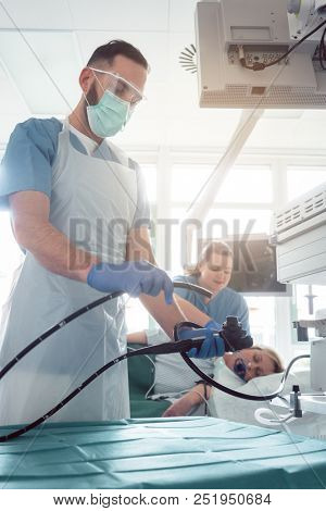 Internist doctors during stomach examination working as a team