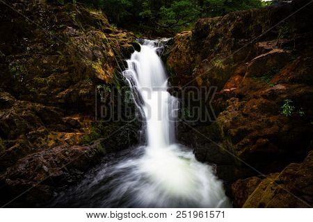 Gorgeous Moody Shot Of Skelwith Force Waterfall In The Lake District In Cumbria, United Kingdom.