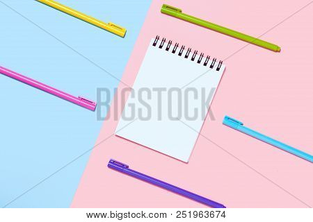Empty Notebook Or Notepad On Pink And Blue Background.