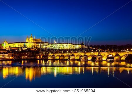 View Of Charles Bridge, Prague Castle And Vltava River In Prague, Czech Republic During Sunset Time.