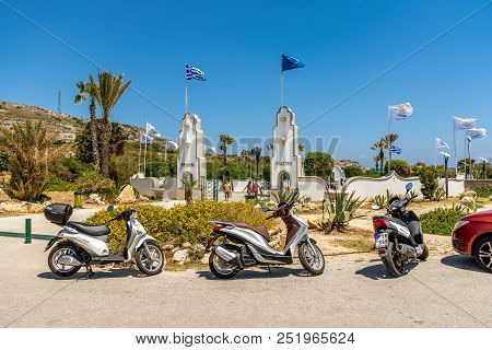 Rhodes, Greece - May 13 2018: Scooters Parked Next To The Entrance To Kalilthea Terms On Rhodes Isla