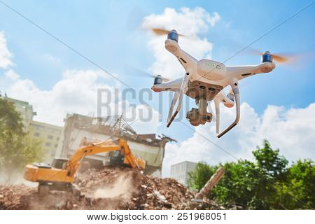 Drone inspecting construction demolition site or building area