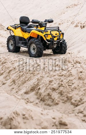 Modern Yellow All-terrain Vehicle Standing In Desert