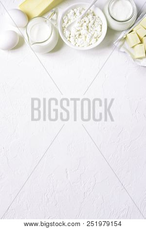 Assortment Of Dairy Products ( Cheese, Cream, Milk, Eggs, Curd, Butter ) .top View With Copy Space.