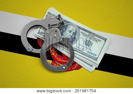 Brunei Darussalam Flag  With Handcuffs And A Bundle Of Dollars. Currency Corruption In The Country. 
