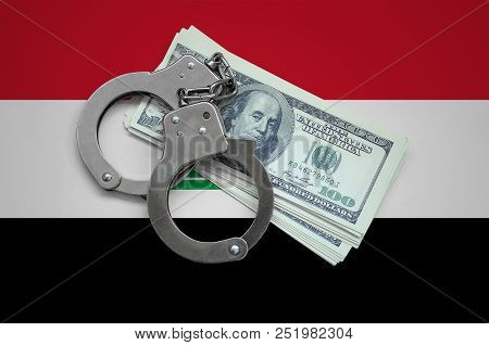 Iraq Flag  With Handcuffs And A Bundle Of Dollars. Currency Corruption In The Country. Financial Cri