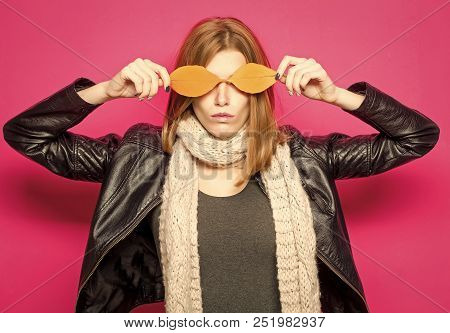 Girl With Orange Leaves On Pink Background.