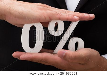 Businessperson Protecting Zero Percentage Symbol