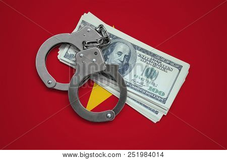 Vietnam Flag  With Handcuffs And A Bundle Of Dollars. Currency Corruption In The Country. Financial 