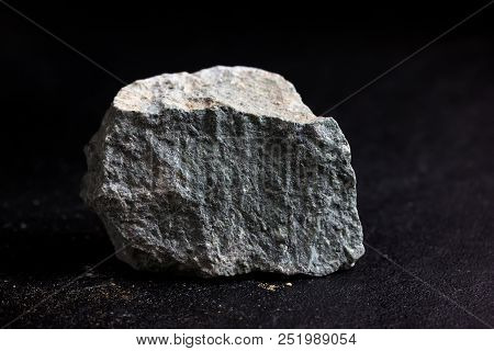 The Kaolinite Stone Isolate On Black Background