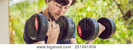 Bicep Curl - Weight Training Fitness Man Outside Working Out Arms Lifting Dumbbells Doing Biceps Cur