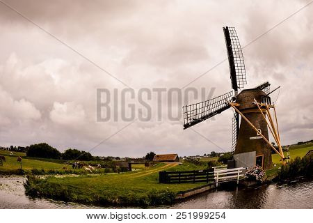 Photograph Of A Classic Vintage Windmill In Holland
