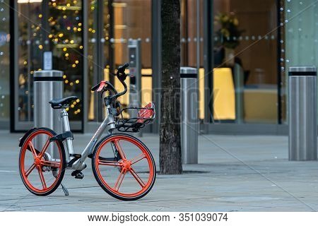 London, England, Uk - December 31, 2019: The Rental Electric Bicycle Is Parked On The Sidewalk Near 