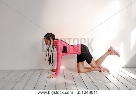 Amazing Professional Fitness Coach Shows How To Do The Exercises Technically Wright. Brunette Braids