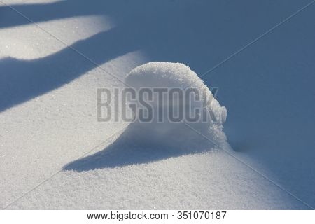 Snow-covered Stump. Winter Snow At The End Of February.