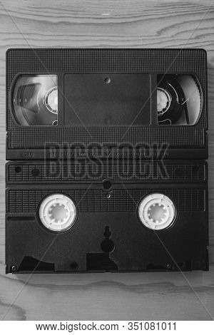 Stack Of Vhs Video Tapes As Background. Old Video Cassette Tapes. Retro Technology.