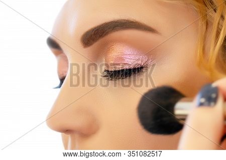 Make-up Artist Doing Makeup For A Beautiful Young Red-haired Girl In A Beauty Salon, A Concept Of Pr