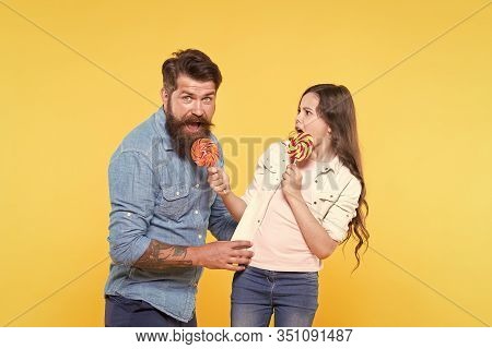 Sharing Sweets With Dearest People. Daughter And Father Eat Sweet Candies. Sweet Dessert. Bearded Hi