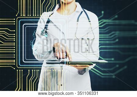 Wooman Doctor Using Tablet With Creative Glowing Digital Heart Futuristic Interface Hologram. Medici