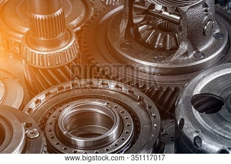 Close-up Of A Car Gearbox. Metallic Shiny  Gear Differential For Planetary Gearshift. Industrial Met