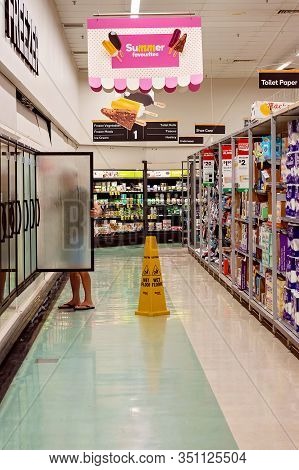 Walkerston, Queensland, Australia - February 2020: A Shopper Looking Inside The Freezer In The Froze