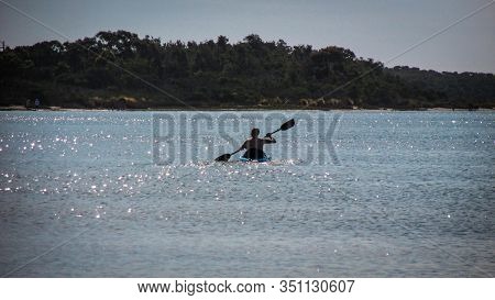 Venus Bay, Au - Jan 3,  2020: Silhouette Of People Doing Water Sport Activity In South Gippsland. Ap
