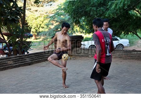 Bagan, Myanmar - Nov 15, 2019: Burmese Men Playing The Traditional Ball Game Of Myanmar: Chinlone.