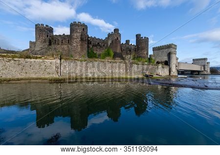 The Metal Box Railway Bridge At The Side Of Conwy Castle Crosses The River Conwy. The Castle Was Bui