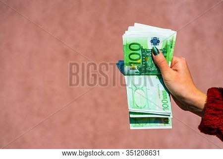 Hand Couting Holding And Showing Euro Money Or Giving Money. World Money Concept, 100 Euro Banknotes