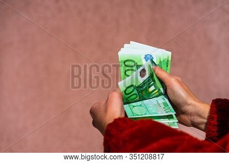 Hand Couting Holding And Showing Euro Money Or Giving Money. World Money Concept, 100 Euro Banknotes