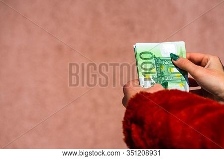 Hand Couting Holding And Showing Euro Money Or Giving Money. World Money Concept, 100 Euro Banknotes