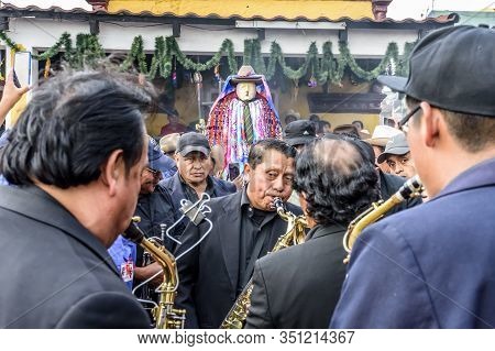 Santiago Atitlan, Guatemala -  April 19, 2019: Musicians & Mayan Deity & Folk Saint Called Maximon O