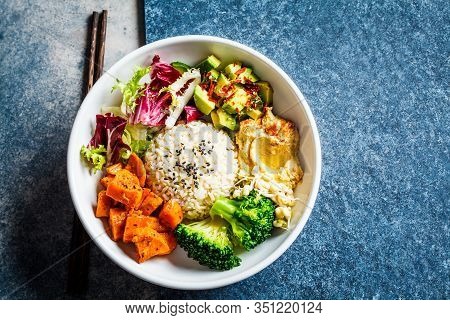 Buddha Bowl. Vegan Rice And Vegetables Salad. Macrobiotic Set With Rice, Hummus, Avocado, Broccoli A