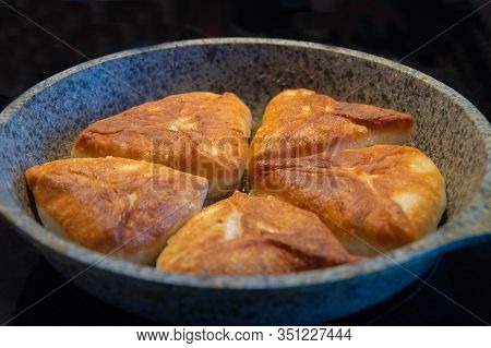 Gray Plate With Delicious Fried Pies On A Black Background, Isolate