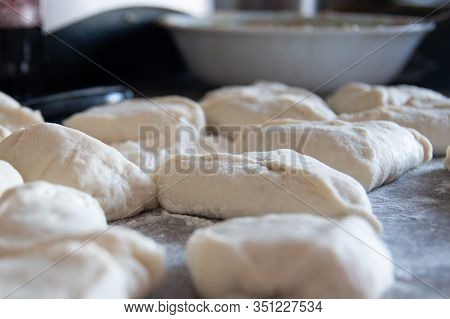 Cooking Meat Pies From Dough Using Flour. Side View. Traditional Russian Cuisine