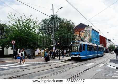 Oslo, Norway - August 11, 2019: Blue Tram Speeding Up In Grunerlokka, A Trendy Hipster Neighborhood 