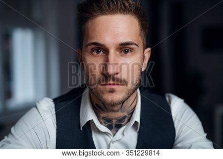 A Front View Of Young Businessman Indoors In Office.