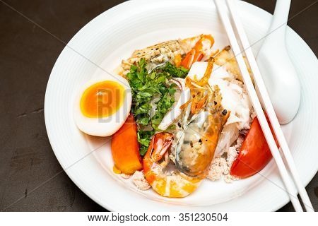 Seafood Thai Noodle Mixxed Together Between Boiled Shrimp, Squid, Pork, Egg And Colourful Vegetable