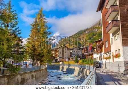 Zermatt, Switzerland - October 7, 2019: Town Street View In Famous Swiss Alps Ski Resort, River, Mat