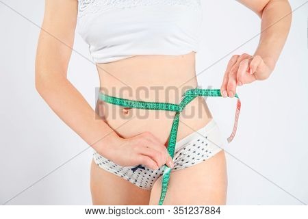 Woman Body After Weight Loss. Cropped Close Up Photo Of Fatless Slender Body Parts And Proportions W