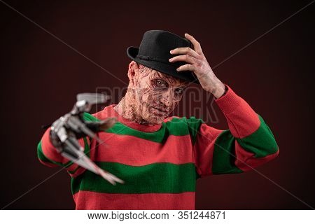 Portrait Of A Man With A Scary Face And Metal Claws. Grimm Hero For A Horror Movie