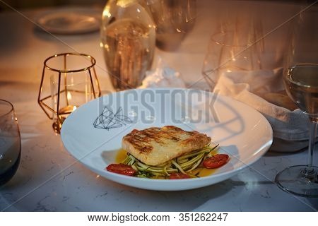 Delicious Fillet Of Grilled And Oven Baked Codfish Or Coalfish Served With Thin Sliced Vegetables An