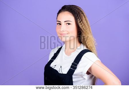 Popular Look. Woman Smiling Face Posing With Stylish Hairstyle On Violet Background. Hair Crimping M